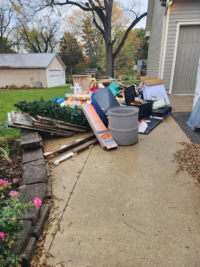 Dumpster being loaded with debris for Residential Dumpster Rental in Clarks Summit
